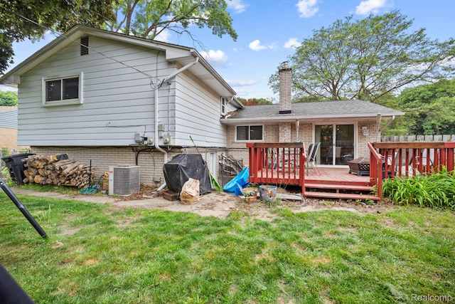 23870 Rockingham St, Southfield, MI 48033 - rear view of property with a chimney, a yard, a wooden deck, and brick siding