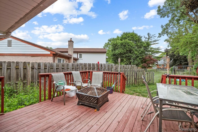 23870 Rockingham St, Southfield, MI 48033 - wooden terrace featuring a fire pit and a fenced backyard