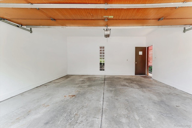 42134 Toddmark Ln, Clinton Township, MI 48038 - garage featuring a garage door opener and baseboards