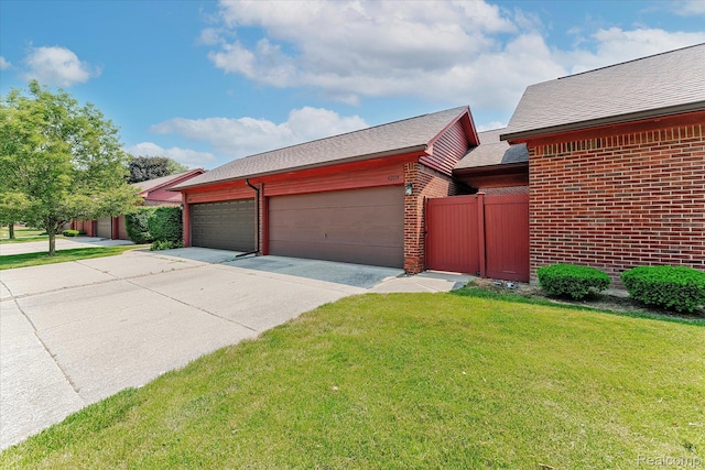 42134 Toddmark Ln, Clinton Township, MI 48038 - view of front of house featuring brick siding, driveway, a shingled roof, and an attached garage