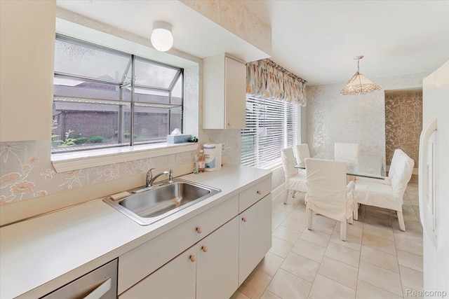 42134 Toddmark Ln, Clinton Township, MI 48038 - kitchen featuring wallpapered walls, dishwashing machine, light countertops, decorative light fixtures, and light tile patterned floors