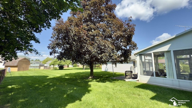 1107 Mccormick St, Monroe, MI 48162 - view of yard with a sunroom