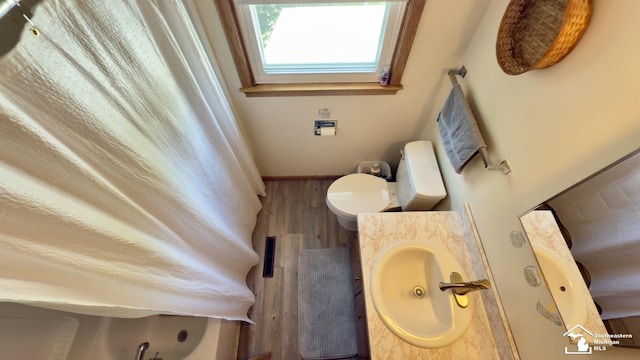 1107 Mccormick St, Monroe, MI 48162 - full bathroom with wood finished floors and vanity