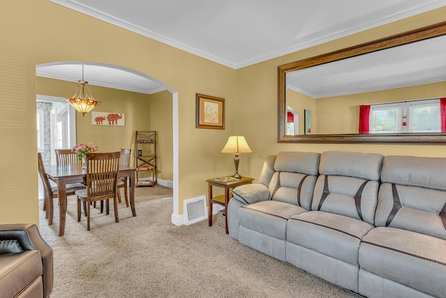 741 Lawrence St, Jackson, MI 49203 - living room featuring carpet flooring, arched walkways, healthy amount of natural light, and ornamental molding