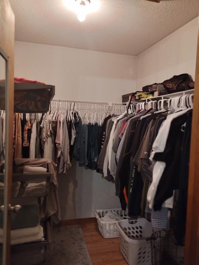 5664 Hall Rd, Muskegon, MI 49442 - spacious closet featuring wood finished floors