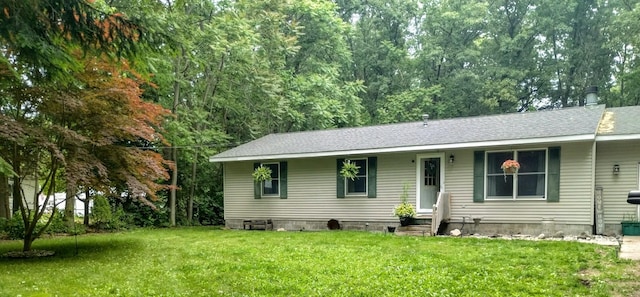 5664 Hall Rd, Muskegon, MI 49442 - view of front of property with a front lawn and a shingled roof