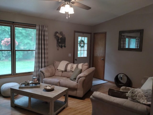 5664 Hall Rd, Muskegon, MI 49442 - living area with a ceiling fan, light wood-style flooring, and lofted ceiling