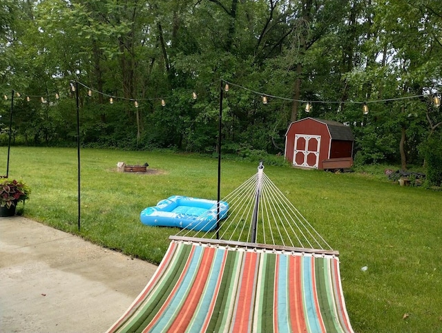 5664 Hall Rd, Muskegon, MI 49442 - view of grassy yard with a shed