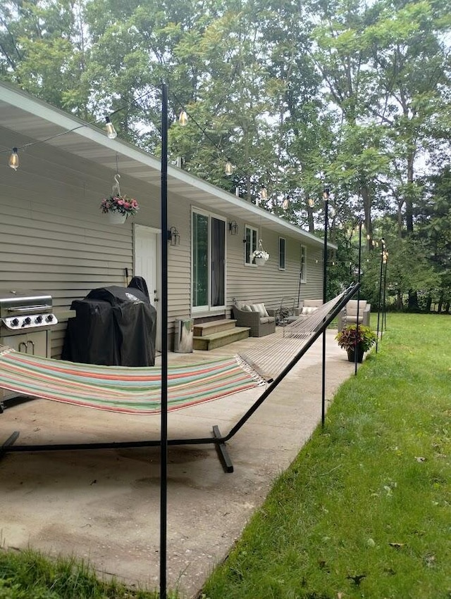 5664 Hall Rd, Muskegon, MI 49442 - back of property featuring entry steps, a yard, and a patio area