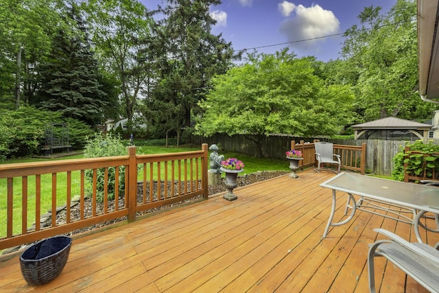 1217 Westmoorland St, Ypsilanti, MI 48197 - deck with a fenced backyard and view of wooded area