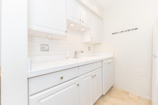 517 Longshore Dr Unit A, Ann Arbor, MI 48105 - kitchen with dishwasher, white cabinets, light countertops, and tasteful backsplash
