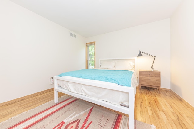 517 Longshore Dr Unit A, Ann Arbor, MI 48105 - bedroom featuring wood finished floors and baseboards