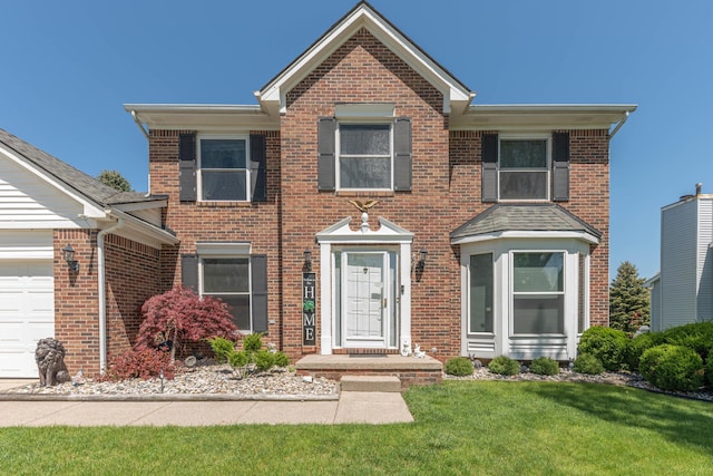 5835 S Ashford Way, Ypsilanti, MI 48197 - view of front facade featuring brick siding and a front yard