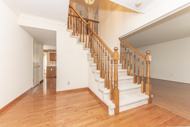5835 S Ashford Way, Ypsilanti, MI 48197 - stairs featuring wood finished floors and crown molding