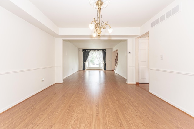 5835 S Ashford Way, Ypsilanti, MI 48197 - spare room with a chandelier and light wood-style floors