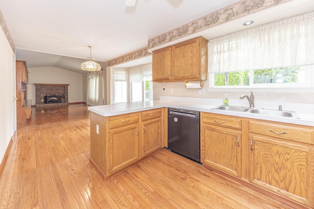 5835 S Ashford Way, Ypsilanti, MI 48197 - kitchen with black dishwasher, a peninsula, open floor plan, light countertops, and vaulted ceiling