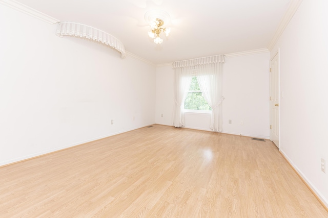 5835 S Ashford Way, Ypsilanti, MI 48197 - spare room with light wood-type flooring, crown molding, and a chandelier