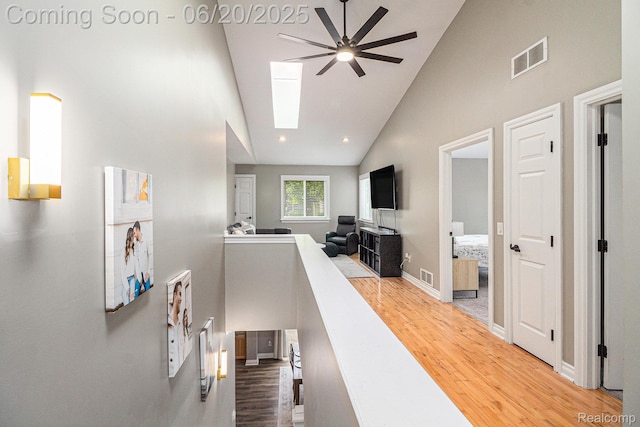 3280 Chambourne St, Ferndale, MI 48382 - living room with high vaulted ceiling, wood finished floors, ceiling fan, a skylight, and recessed lighting