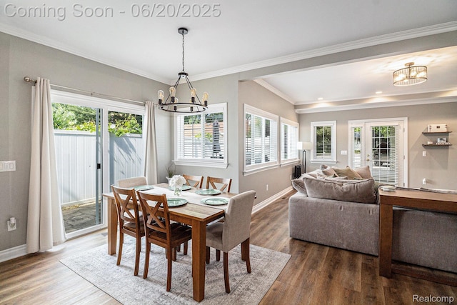 3280 Chambourne St, Ferndale, MI 48382 - dining room featuring a chandelier, healthy amount of natural light, wood finished floors, and crown molding