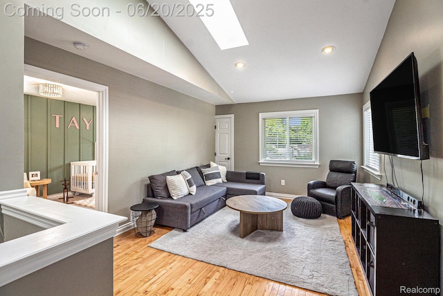 3280 Chambourne St, Ferndale, MI 48382 - living room featuring vaulted ceiling, light wood-style floors, a skylight, and recessed lighting
