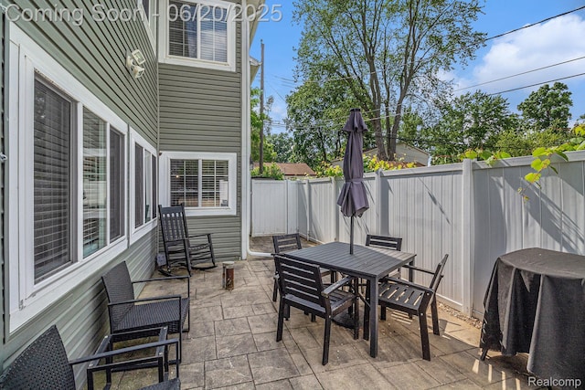 3280 Chambourne St, Ferndale, MI 48382 - fenced backyard with outdoor dining space, a patio, and grilling area