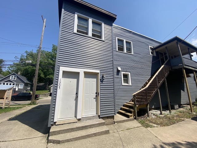 251 Page St NE, Grand Rapids, MI 49505 - rear view of house featuring stairway