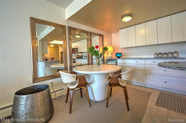 35300 Woodward Ave Unit 503, Birmingham, MI 48009 - dining space with a baseboard radiator and light tile patterned floors