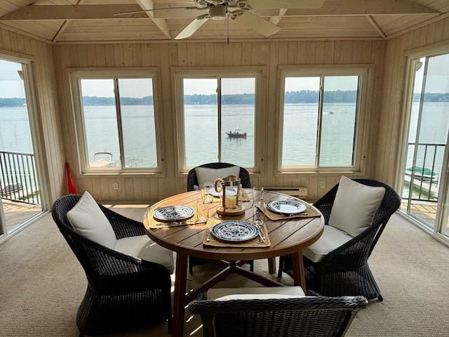 68121 Edgewater Beach Rd, White Pigeon, MI 49099 - sunroom / solarium featuring carpet floors, a water view, wood walls, plenty of natural light, and wooden ceiling