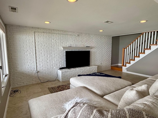 68121 Edgewater Beach Rd, White Pigeon, MI 49099 - living area featuring stairs, recessed lighting, a brick fireplace, and brick wall