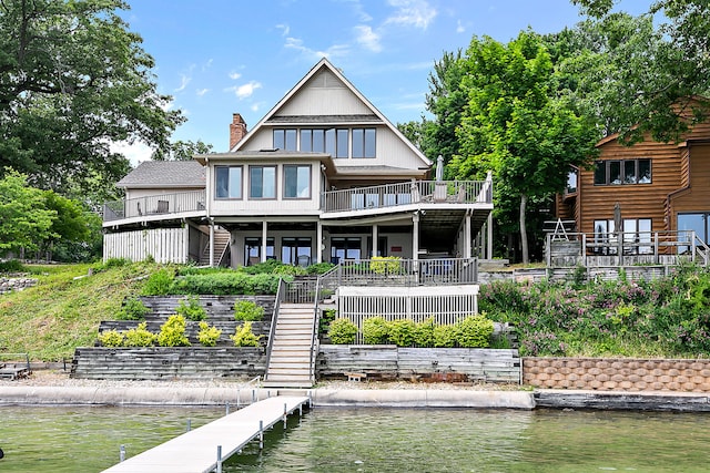 68121 Edgewater Beach Rd, White Pigeon, MI 49099 - back of house featuring stairway, a deck with water view, and a chimney