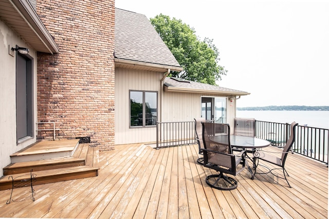 68121 Edgewater Beach Rd, White Pigeon, MI 49099 - wooden terrace featuring outdoor dining area and a water view