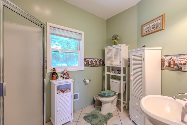 7111 Gilbert Rd, Pittsford, MI 49271 - bathroom with tile patterned flooring and a stall shower