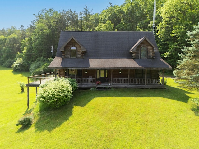 7111 Gilbert Rd, Pittsford, MI 49271 - log cabin featuring a front yard, log siding, and covered porch