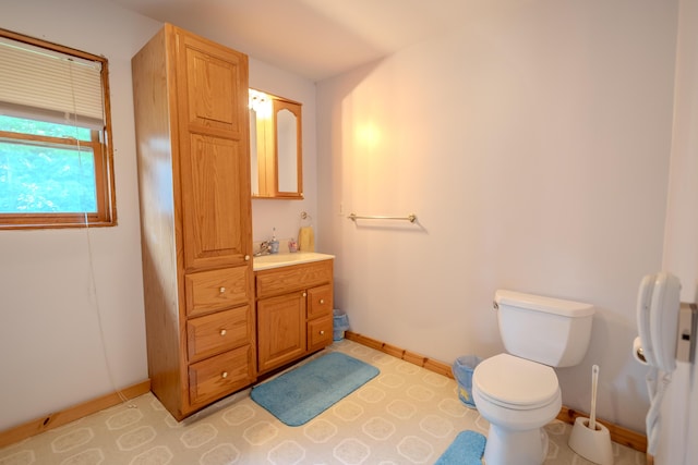 7111 Gilbert Rd, Pittsford, MI 49271 - bathroom featuring baseboards and vanity