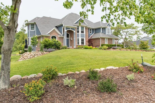 5284 Green Pine Ln, Kalamazoo, MI 49009 - view of front of house featuring brick siding and a front yard