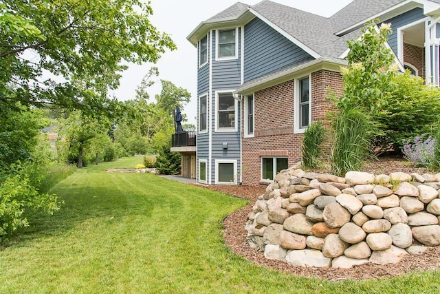 5284 Green Pine Ln, Kalamazoo, MI 49009 - back of property with brick siding, a yard, and a shingled roof