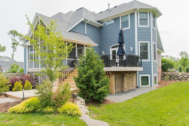 5284 Green Pine Ln, Kalamazoo, MI 49009 - back of house with a lawn, stairs, a shingled roof, and a wooden deck