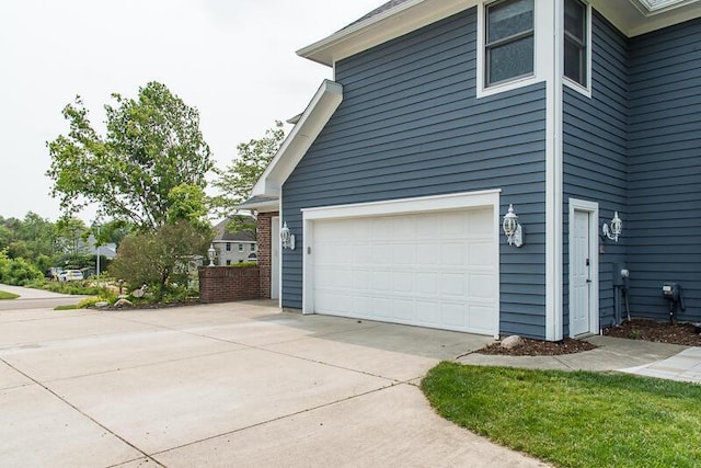 5284 Green Pine Ln, Kalamazoo, MI 49009 - view of home's exterior featuring concrete driveway and an attached garage