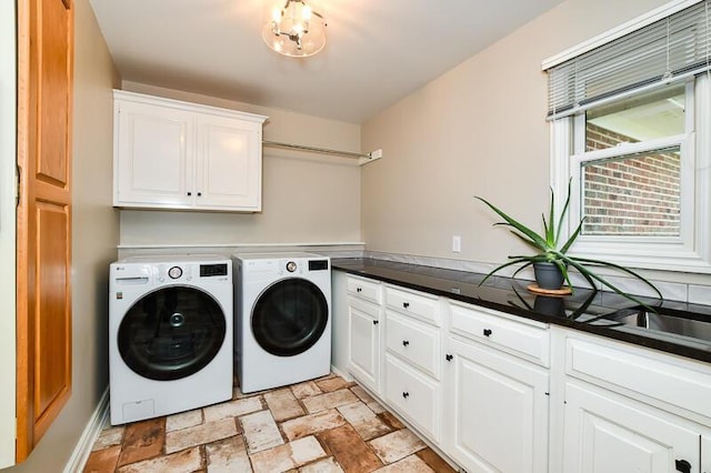 5284 Green Pine Ln, Kalamazoo, MI 49009 - laundry room with cabinet space, washing machine and dryer, and stone finish flooring