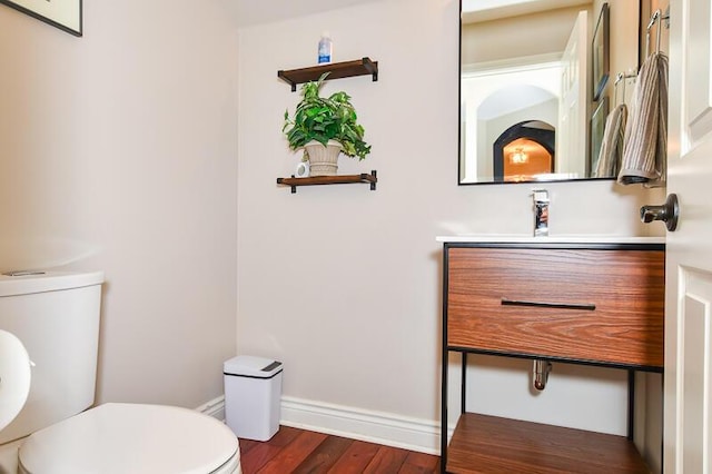 5284 Green Pine Ln, Kalamazoo, MI 49009 - half bathroom with toilet and wood finished floors