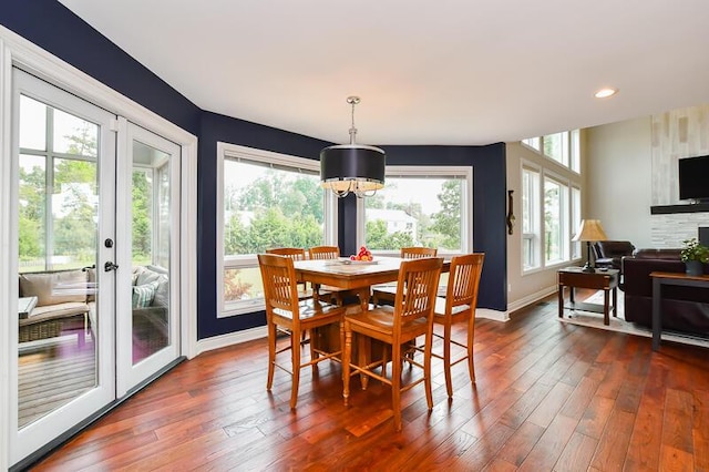 5284 Green Pine Ln, Kalamazoo, MI 49009 - dining area with dark wood finished floors, a chandelier, french doors, and recessed lighting