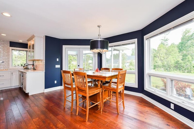 5284 Green Pine Ln, Kalamazoo, MI 49009 - dining area with dark wood finished floors, healthy amount of natural light, a chandelier, and recessed lighting