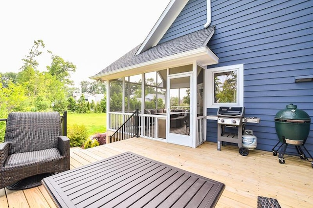 5284 Green Pine Ln, Kalamazoo, MI 49009 - wooden deck with area for grilling and a sunroom