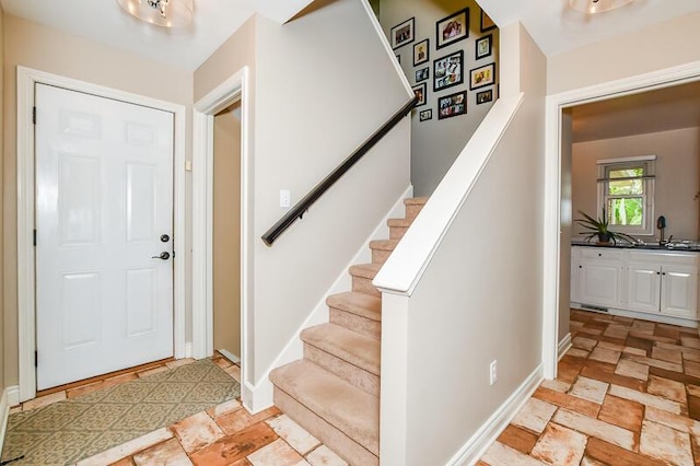 5284 Green Pine Ln, Kalamazoo, MI 49009 - foyer with light stone finish flooring and stairway
