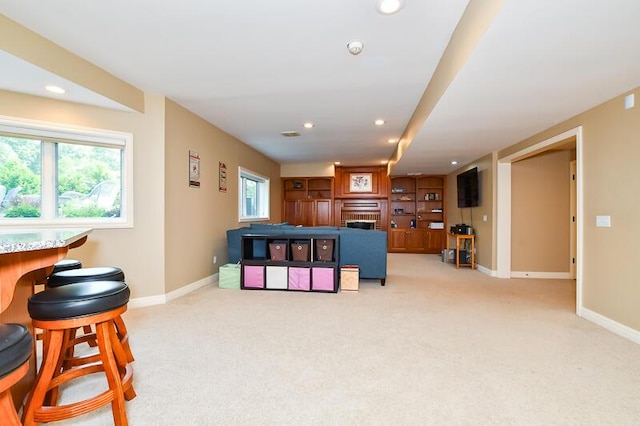 5284 Green Pine Ln, Kalamazoo, MI 49009 - living area with carpet, a fireplace, and recessed lighting