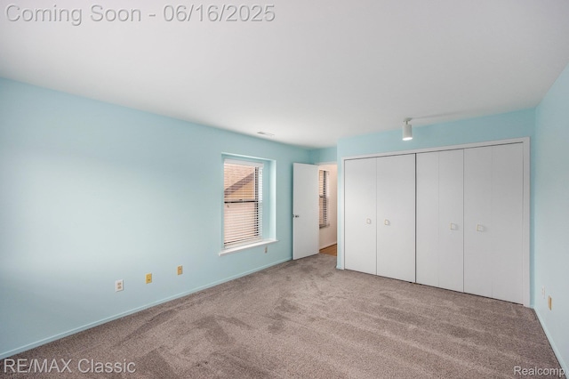 6700 Ridgefield Cir Unit 201, West Bloomfield, MI 48322 - unfurnished bedroom featuring carpet flooring and a closet