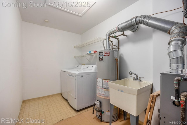 6700 Ridgefield Cir Unit 201, West Bloomfield, MI 48322 - washroom with washing machine and clothes dryer, gas water heater, and light floors
