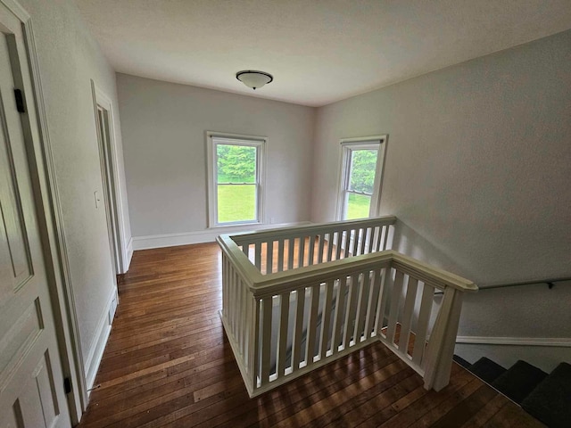 20051 Capital Ave NE, Battle Creek, MI 49017 - stairs with hardwood / wood-style flooring and baseboards