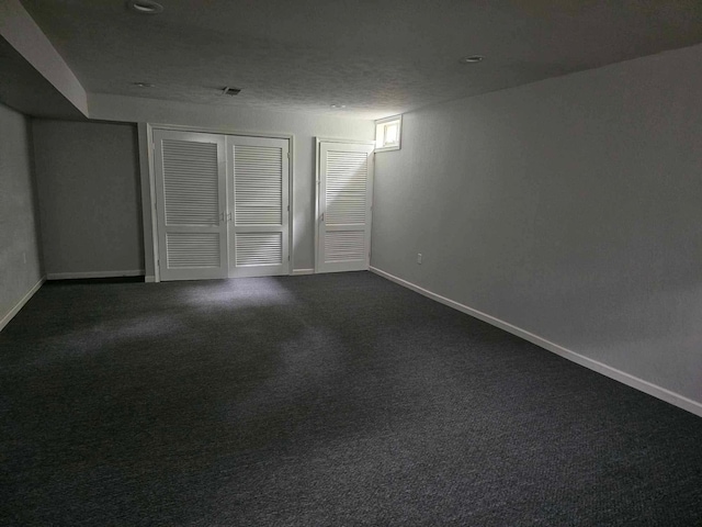 20051 Capital Ave NE, Battle Creek, MI 49017 - finished below grade area with dark carpet and baseboards