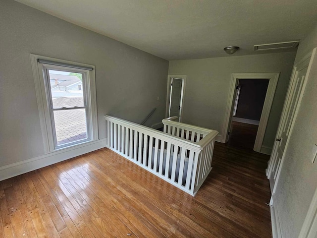 20051 Capital Ave NE, Battle Creek, MI 49017 - unfurnished room featuring hardwood / wood-style floors and baseboards